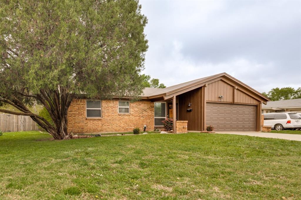 2413 Cheyenne Street Irving, TX 75062 - Photo 3 of 19 a front view of house with yard and green space