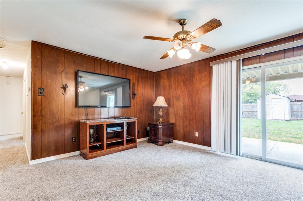 2413 Cheyenne Street Irving, TX 75062 - Photo 5 of 19 a view of a livingroom with a ceiling fan and a window