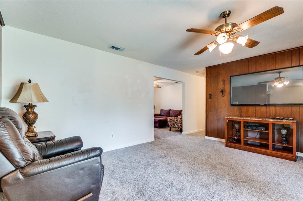 2413 Cheyenne Street Irving, TX 75062 - Photo 6 of 19 a living room with furniture and a flat screen tv