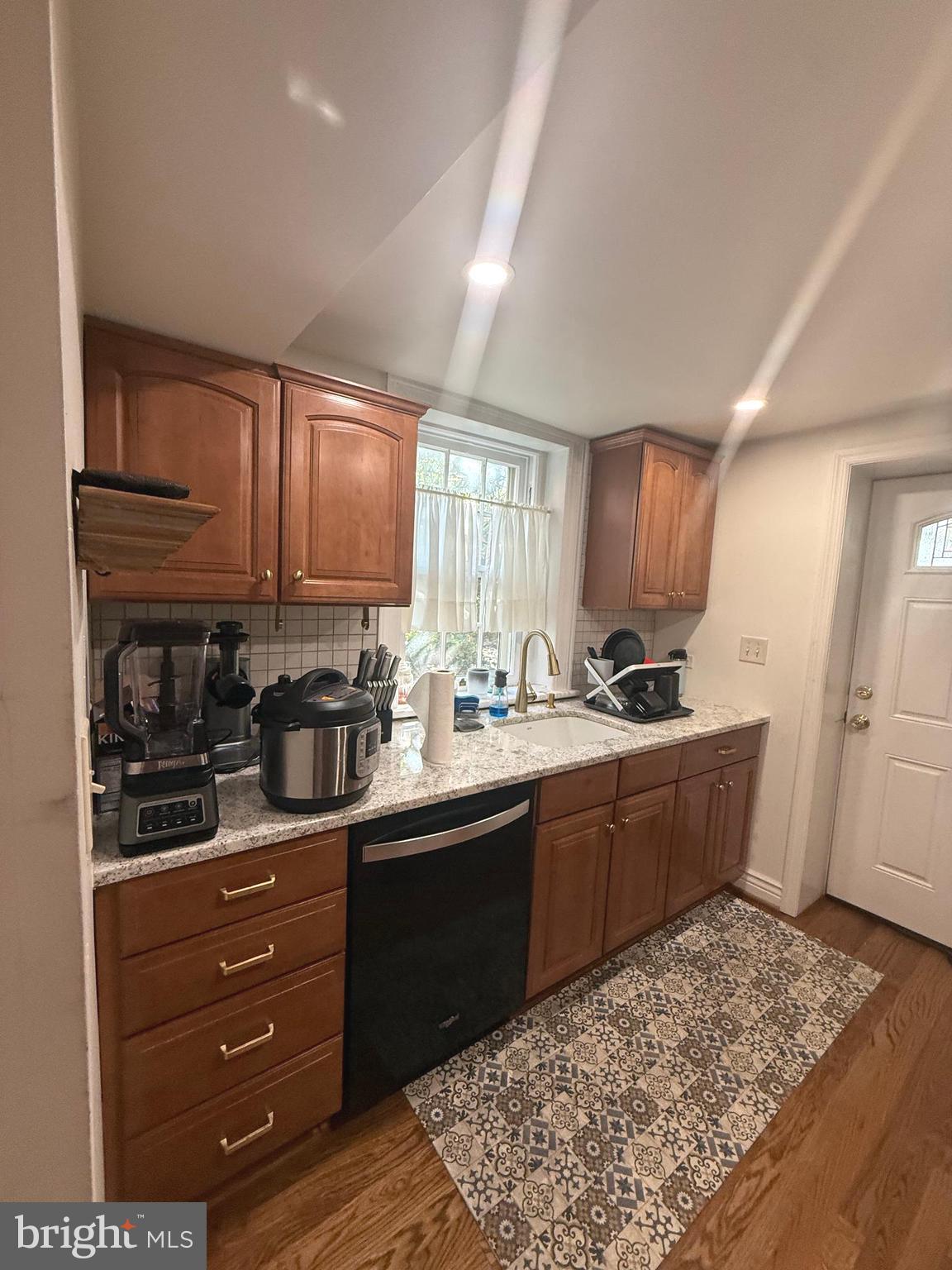 37 South Prospect Street, Unit 101 Hagerstown, MD 21740 - Photo 15 of 51 a kitchen with stainless steel appliances kitchen island granite countertop a refrigerator sink and cabinets