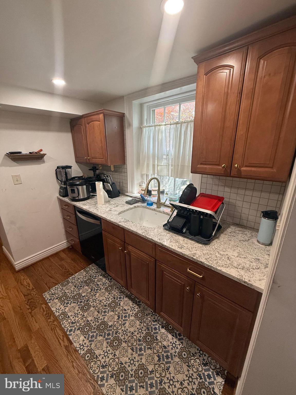 37 South Prospect Street, Unit 101 Hagerstown, MD 21740 - Photo 16 of 51 a kitchen with stainless steel appliances granite countertop a sink stove and cabinets