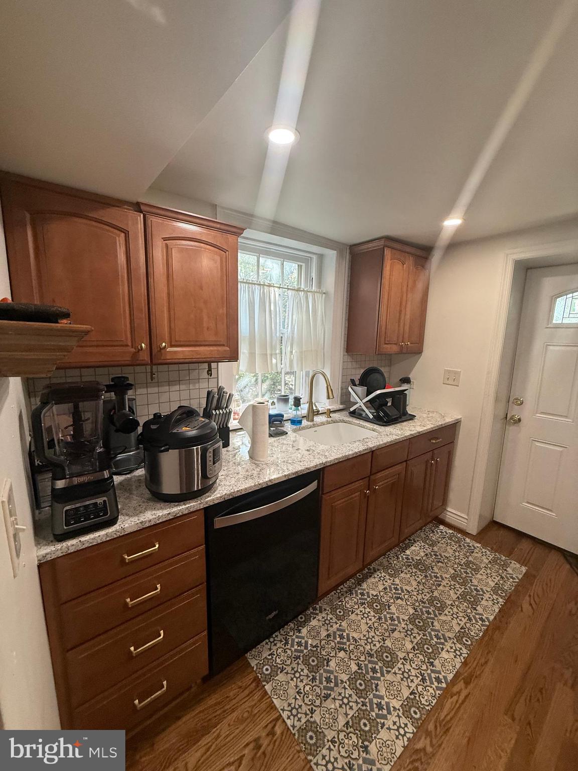 37 South Prospect Street, Unit 101 Hagerstown, MD 21740 - Photo 18 of 51 a kitchen with stainless steel appliances kitchen island granite countertop a sink stove and cabinets