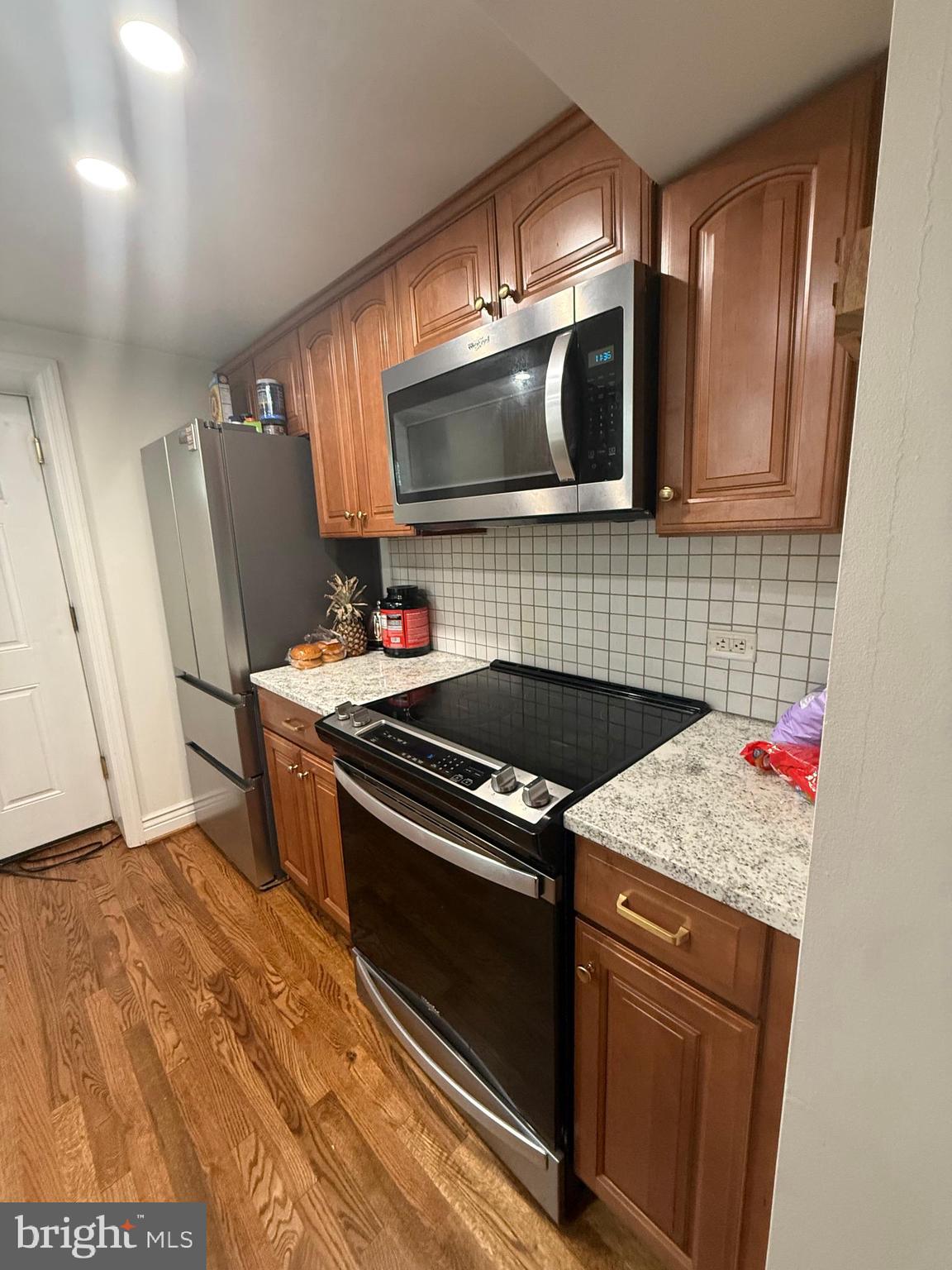 37 South Prospect Street, Unit 101 Hagerstown, MD 21740 - Photo 19 of 51 a kitchen with a stove and a microwave