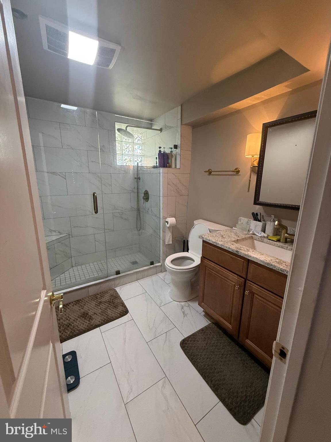37 South Prospect Street, Unit 101 Hagerstown, MD 21740 - Photo 21 of 51 a bathroom with a double vanity sink toilet and shower