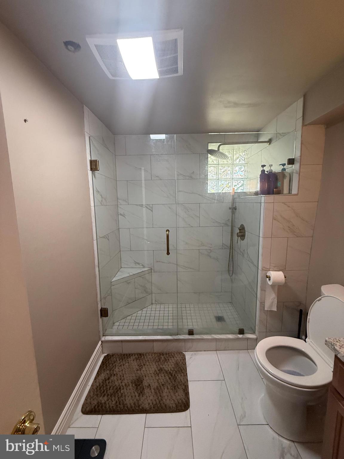 37 South Prospect Street, Unit 101 Hagerstown, MD 21740 - Photo 27 of 51 a bathroom with a shower and toilet