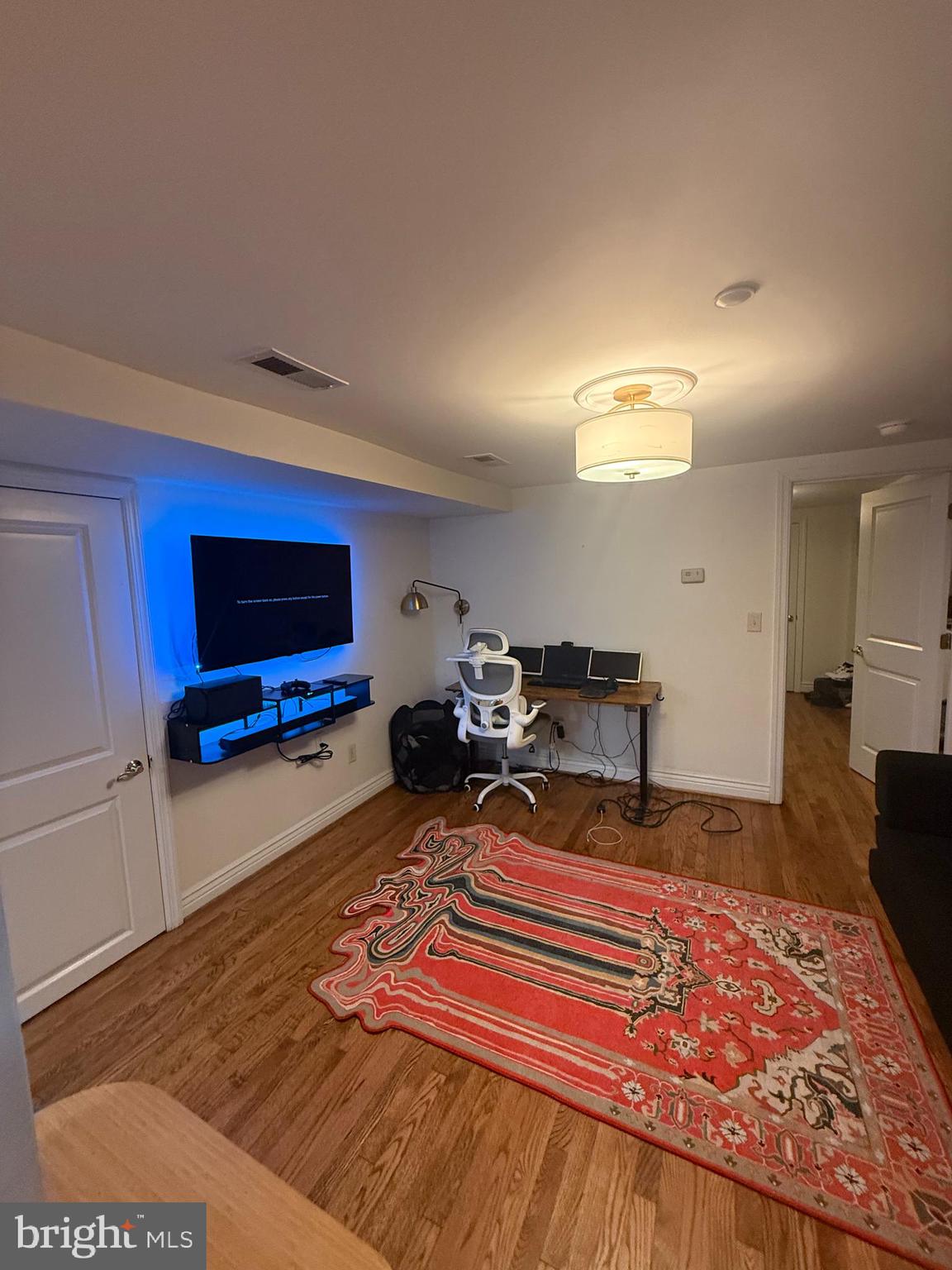 37 South Prospect Street, Unit 101 Hagerstown, MD 21740 - Photo 45 of 51 a living room with furniture and a flat screen tv