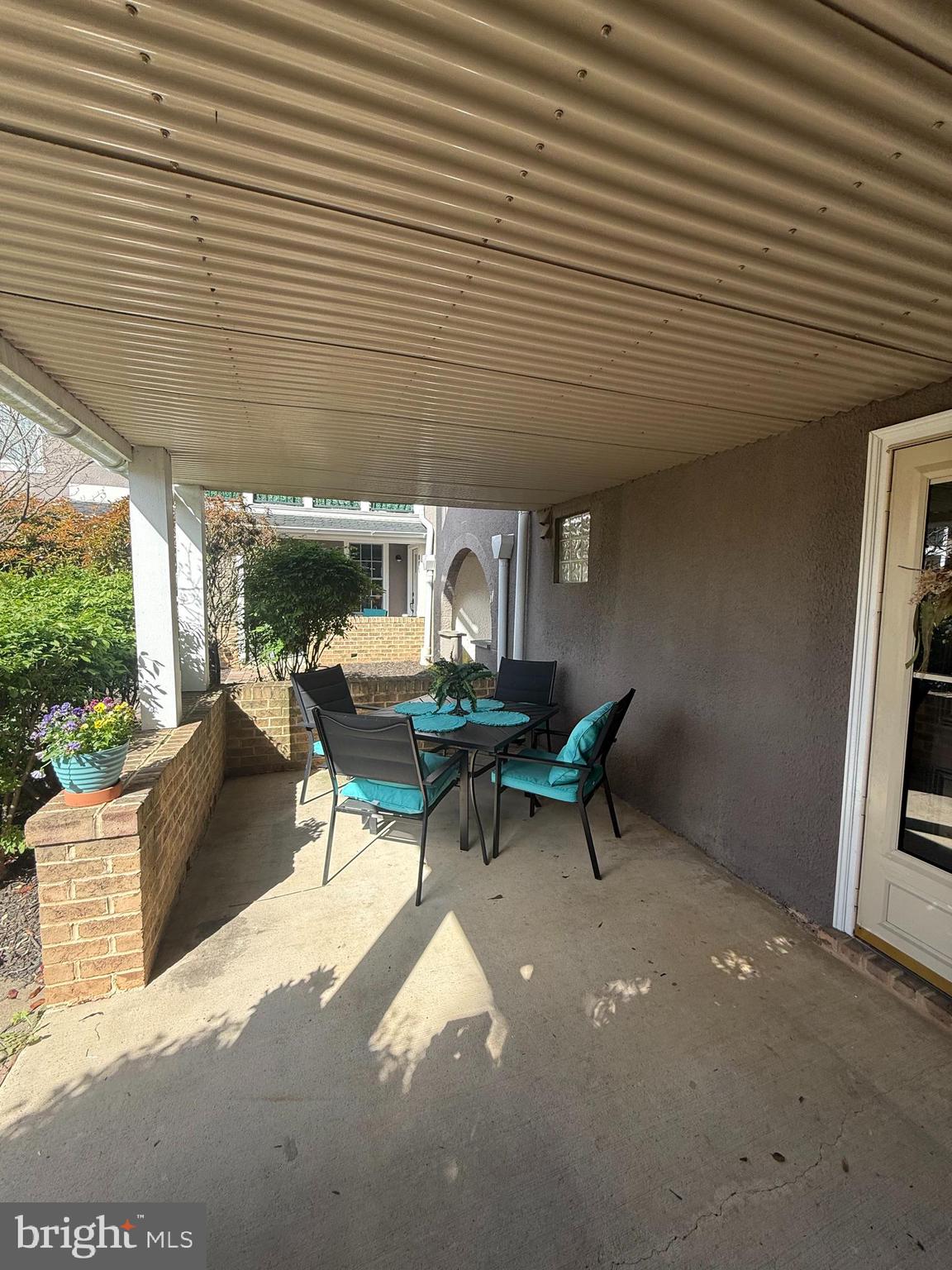 37 South Prospect Street, Unit 101 Hagerstown, MD 21740 - Photo 10 of 51 a view of a patio with table and chairs with wooden floor and fence