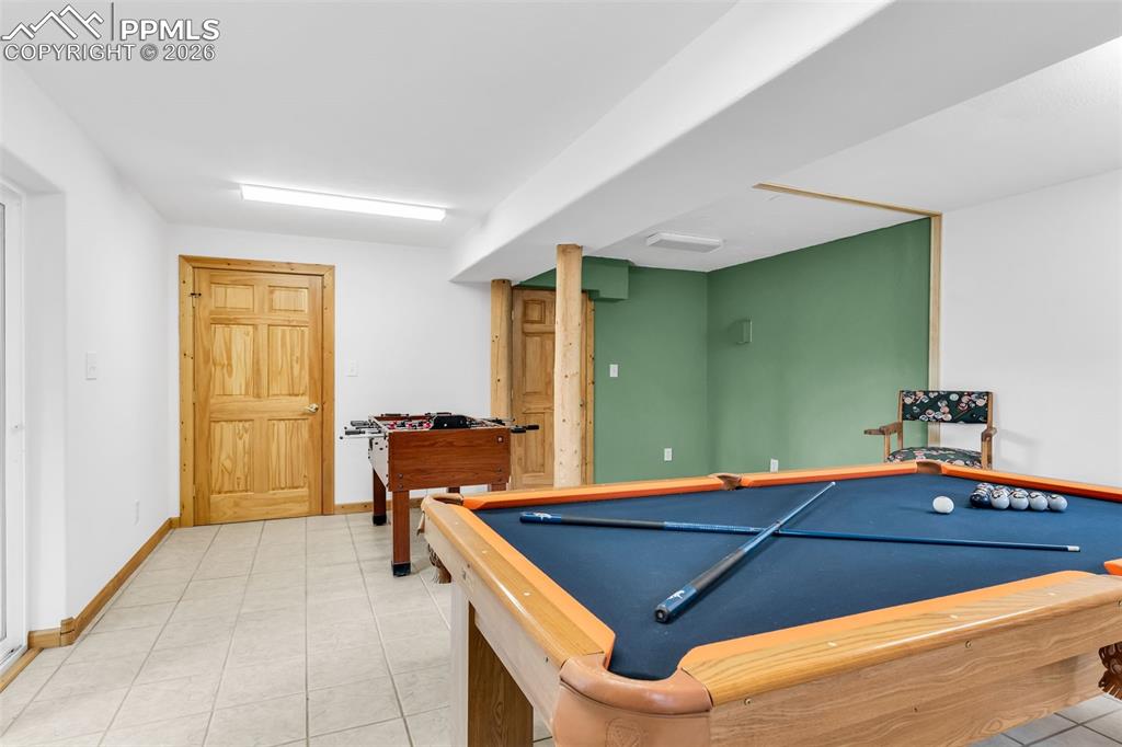 209 Rosewood Road Westcliffe, CO 81252 - Photo 37 of 49 Great space for a bar or kitchenette in the current gameroom. Would also make a great workshop with easy access to outside!