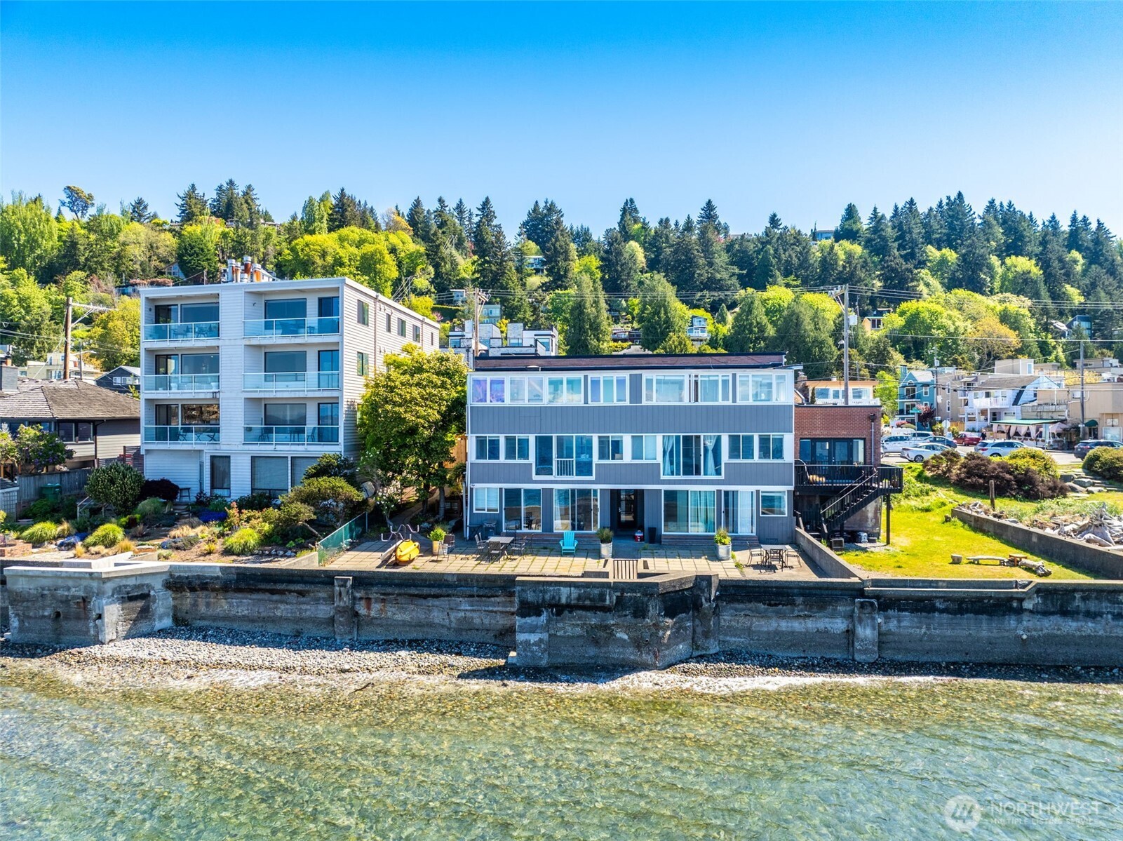 4027 Beach Drive Southwest, Unit 8 Seattle, WA 98116 - Photo 1 of 1 a front view of a house with swimming pool