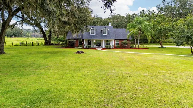 a front view of a building with garden