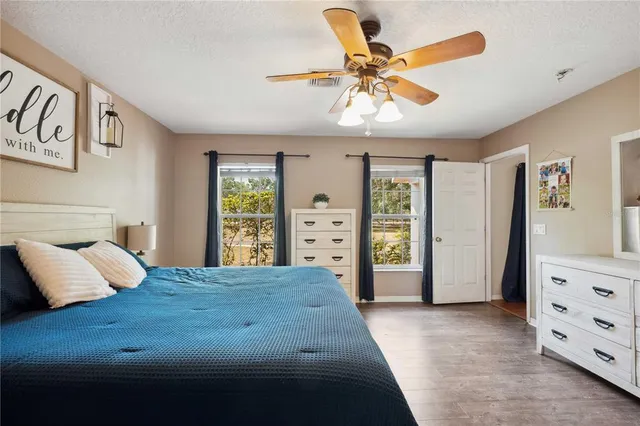a living room with furniture and a baby crib