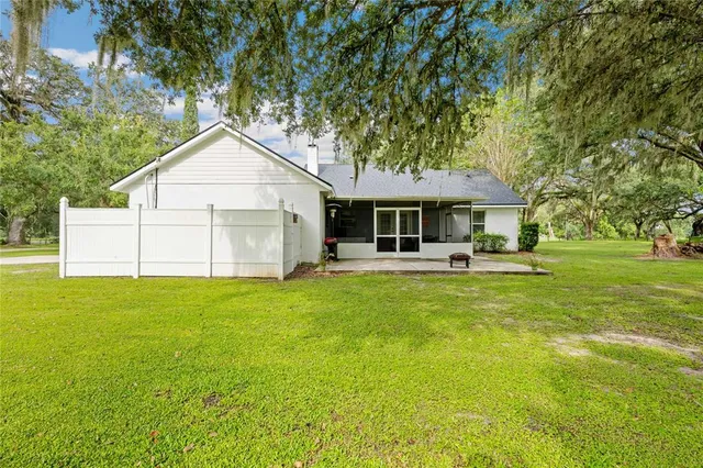 a view of a swimming pool with a yard