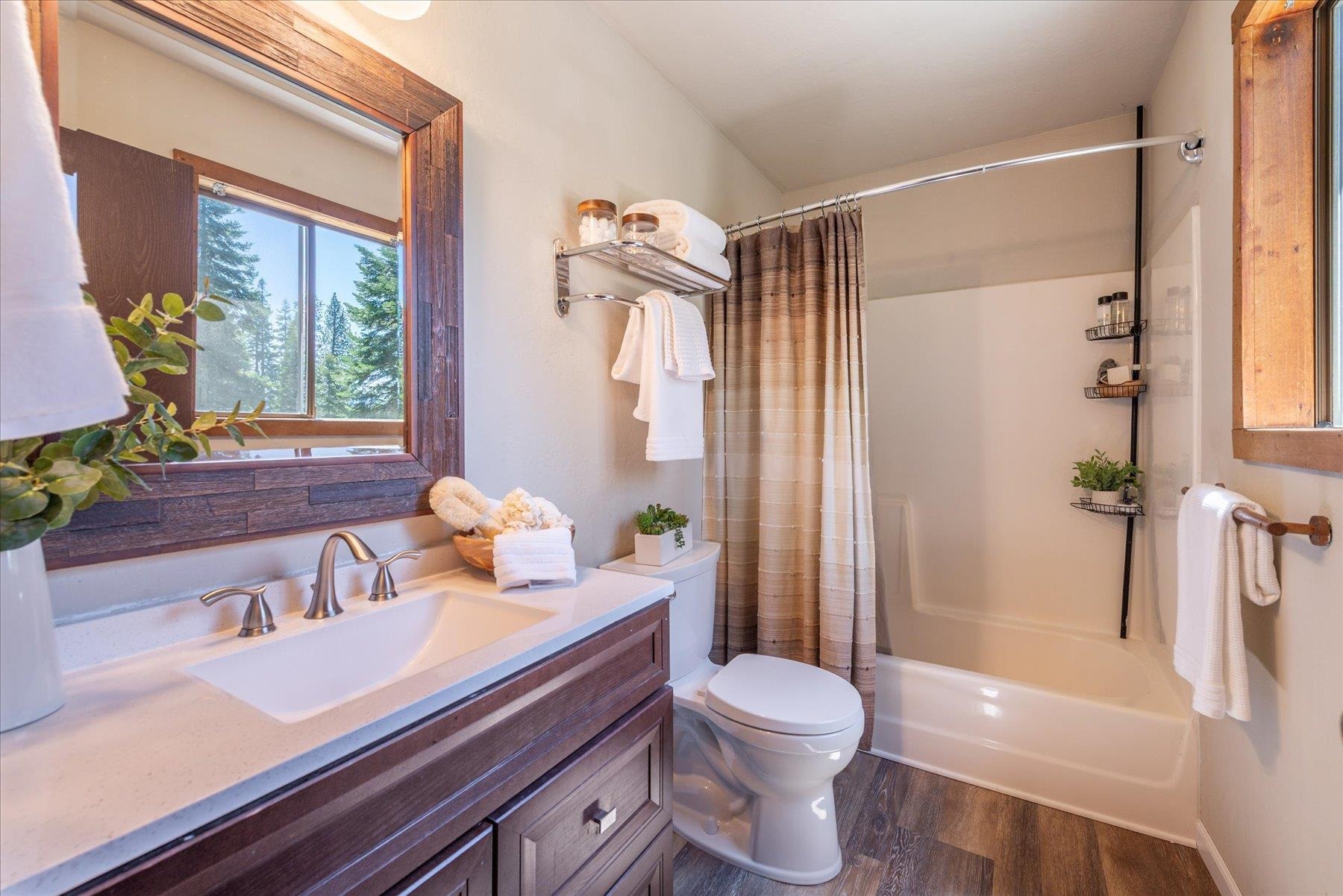 325 North Ridge Road Carnelian Bay, CA 96140 - Photo 17 of 22 a bathroom with a sink a toilet and shower
