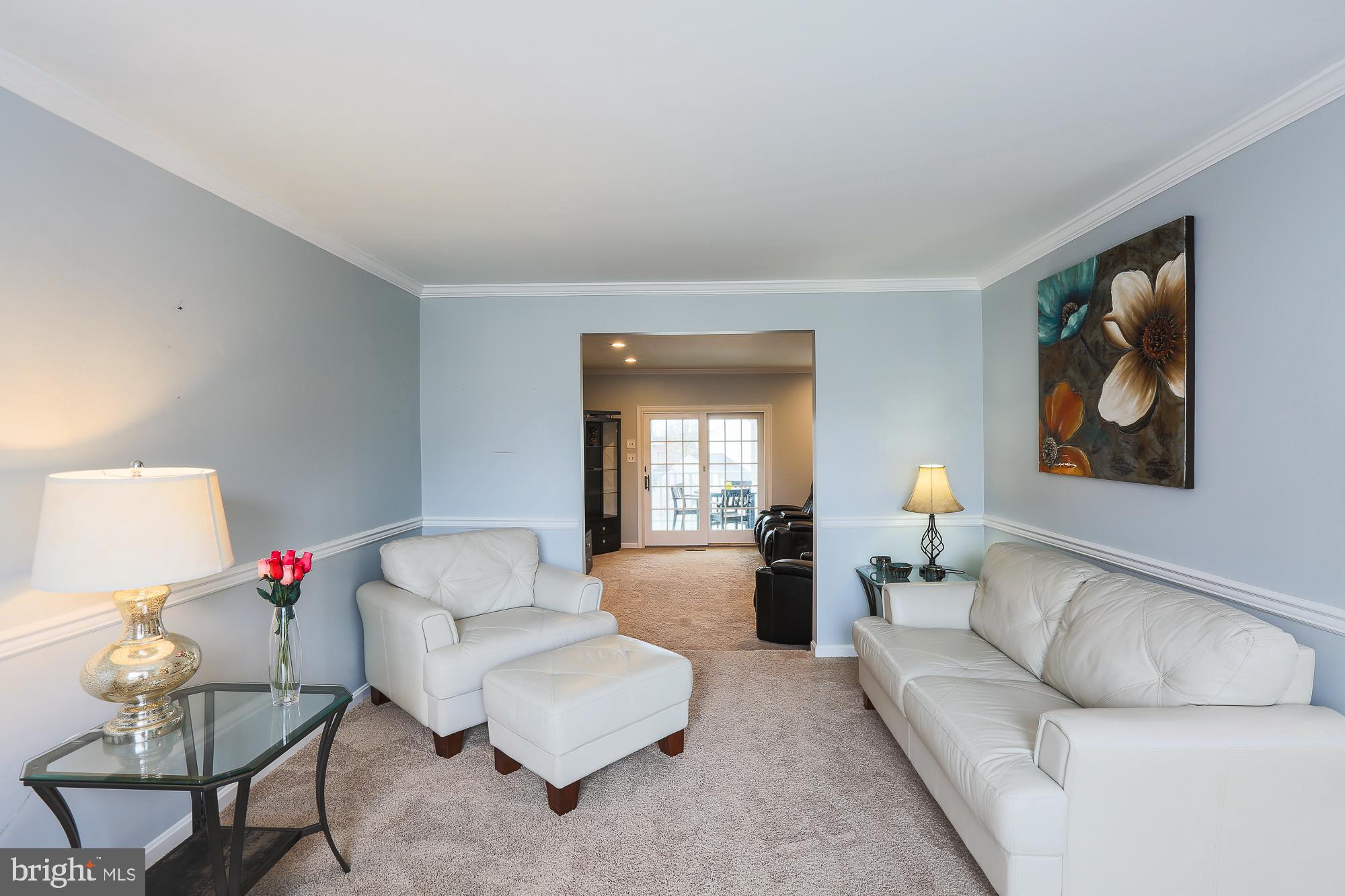 4322 Mispillion Road Baltimore, MD 21236 - Photo 22 of 60 a living room with furniture and a wooden floor