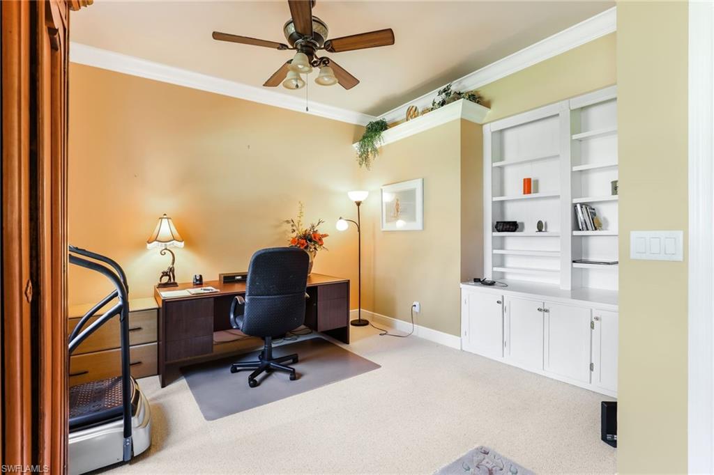 8906 Lely Island Circle Naples, FL 34113 - Photo 26 of 34 a workspace with chandelier