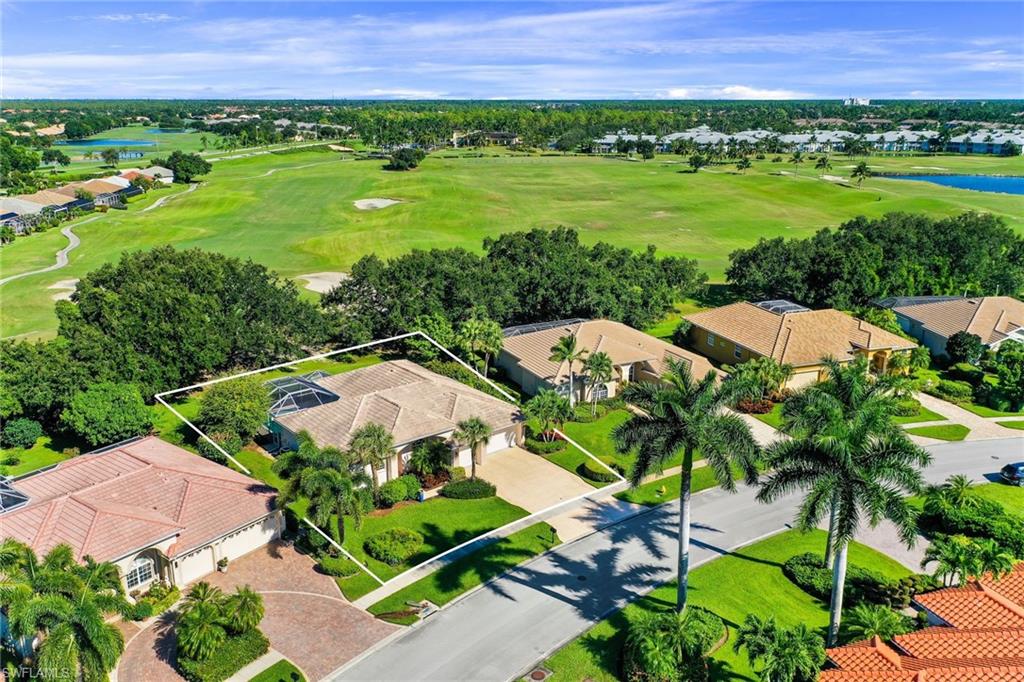 8906 Lely Island Circle Naples, FL 34113 - Photo 33 of 34 a view of a garden with an outdoor space