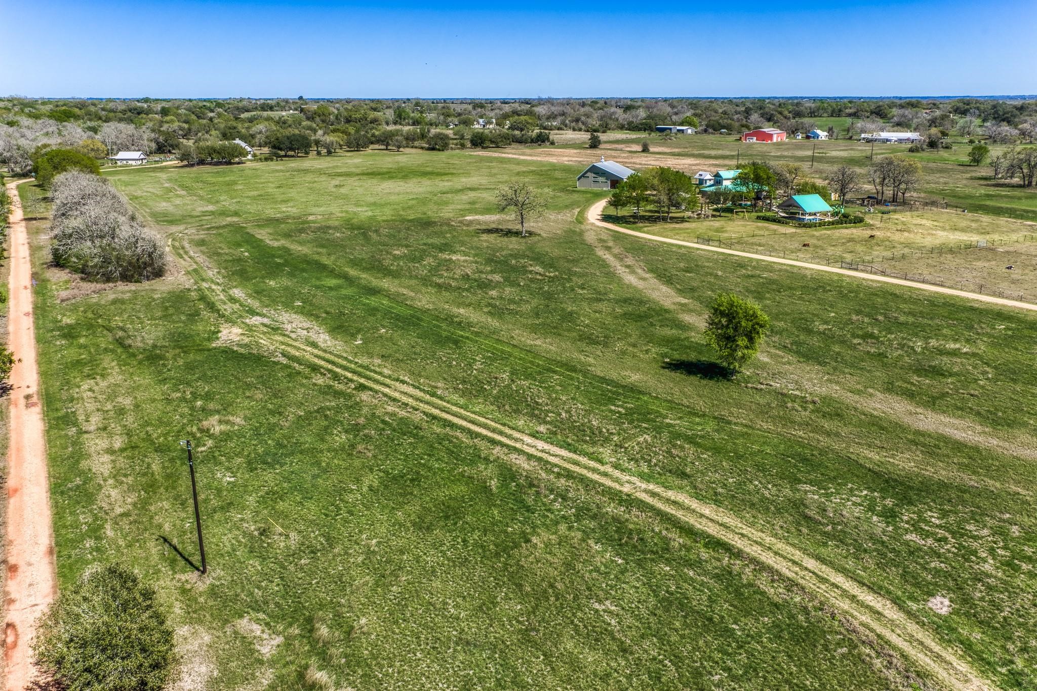 11646 Schuster Road Round Top, TX 78954 - Photo 6 of 8 a view of lake with city view