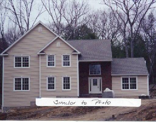 1 Wood Road Redding, CT 06896 - Photo 1 of 1 a front view of a house with a yard and garage