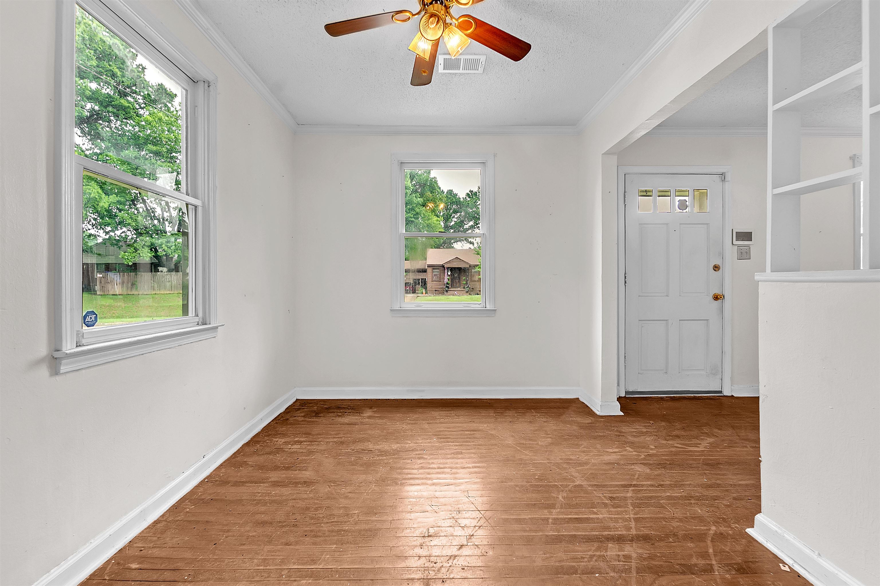 1013 Waring Road Memphis, TN 38122 - Photo 4 of 11 wooden floor in an empty room with a window