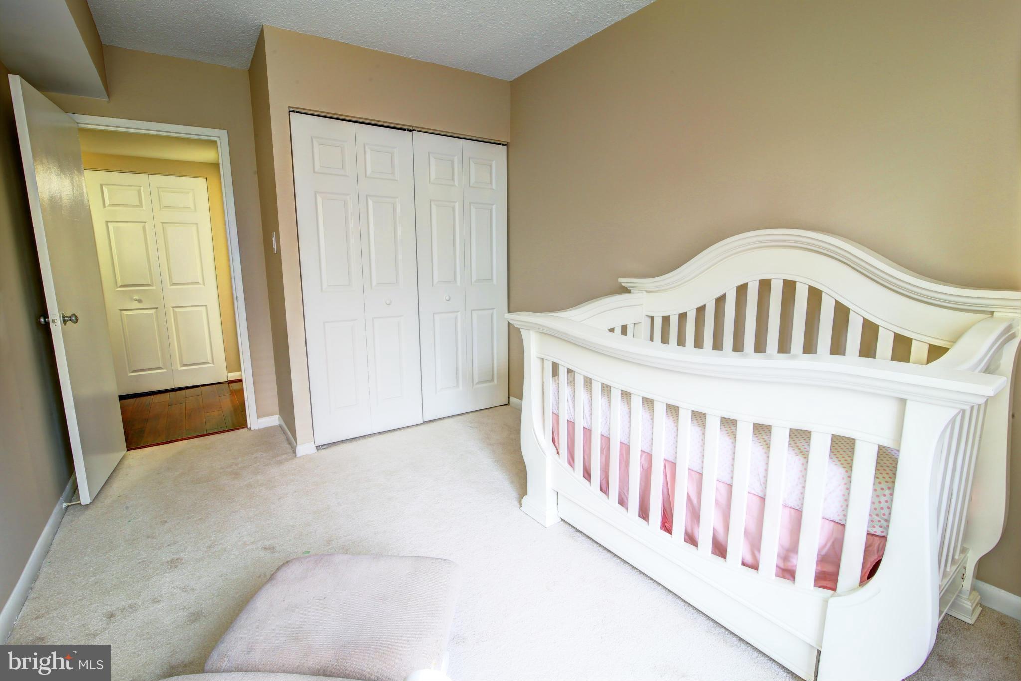 11627 Stoneview Square, Unit 11C Reston, VA 20191 - Photo 14 of 19 a view of a bedroom with wooden floor
