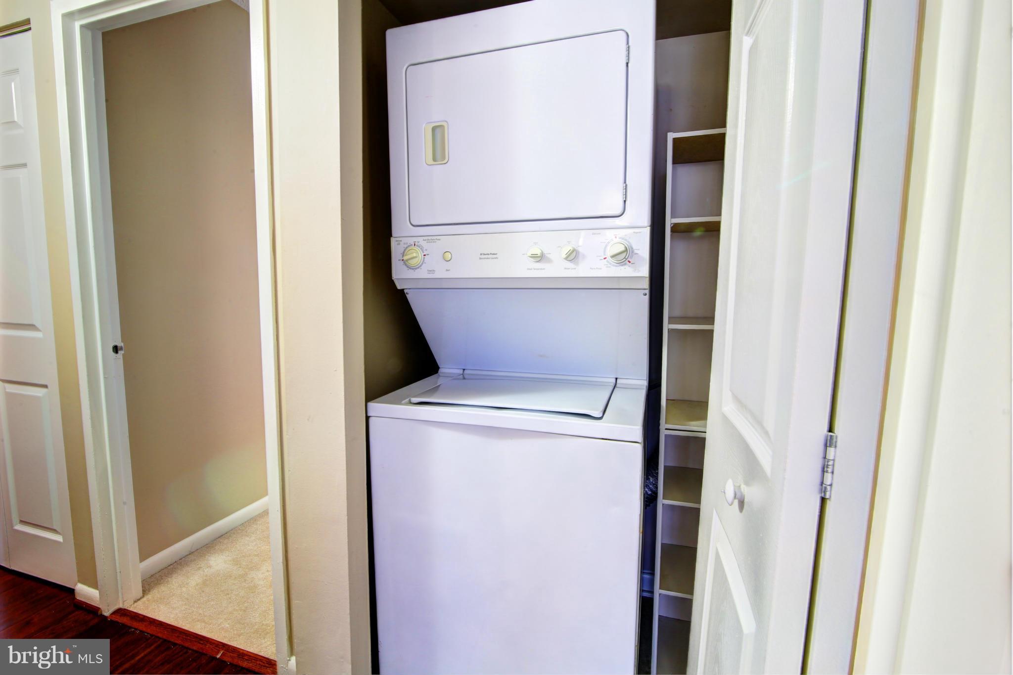 11627 Stoneview Square, Unit 11C Reston, VA 20191 - Photo 17 of 19 a utility room with dryer and washer