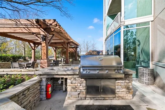 a view of a patio with table and chairs potted plants