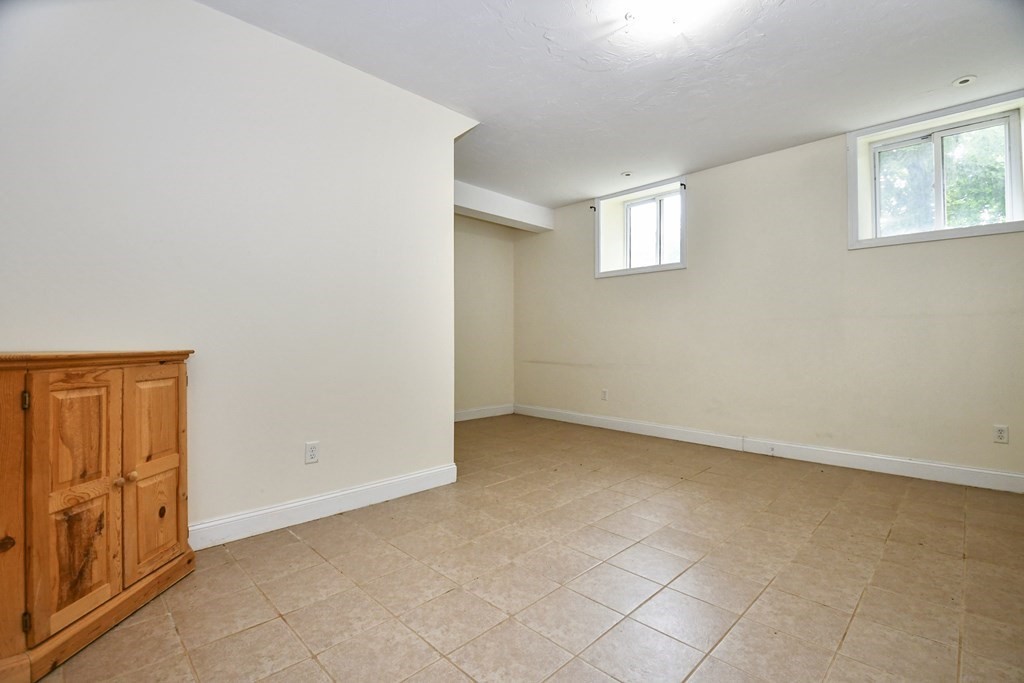 32 Providence Street, Unit 5 Worcester, MA 01604 - Photo 12 of 24 an empty room with windows