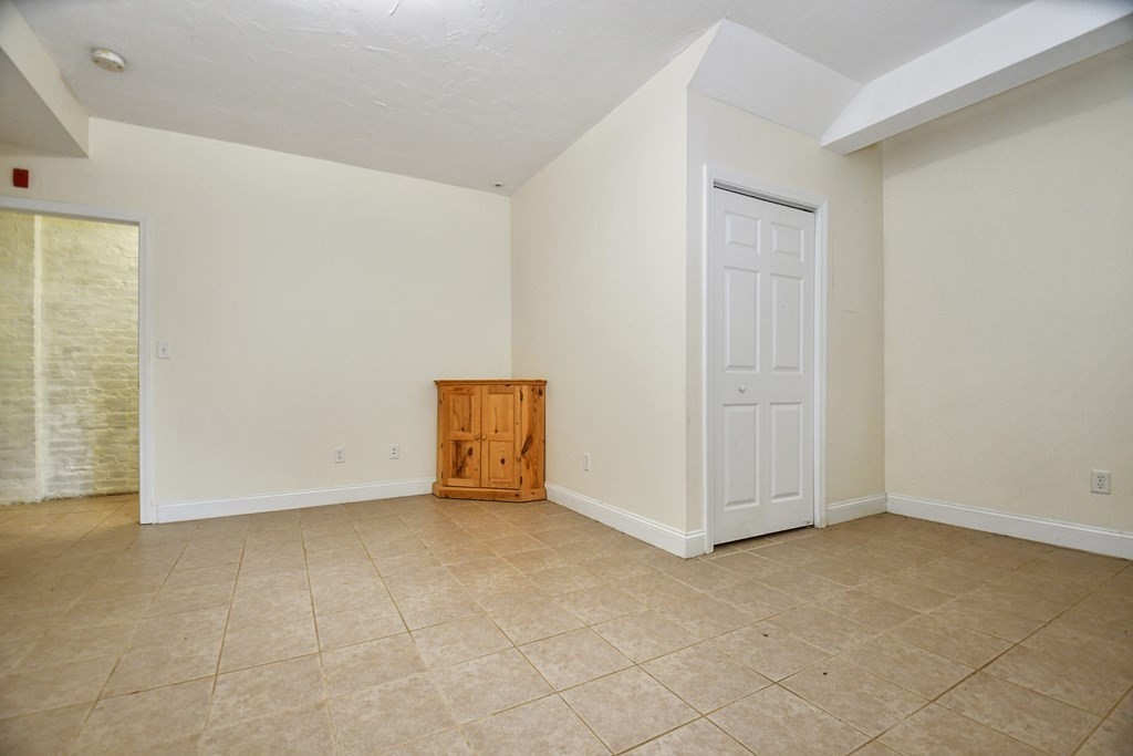 32 Providence Street, Unit 5 Worcester, MA 01604 - Photo 13 of 24 an empty room with windows