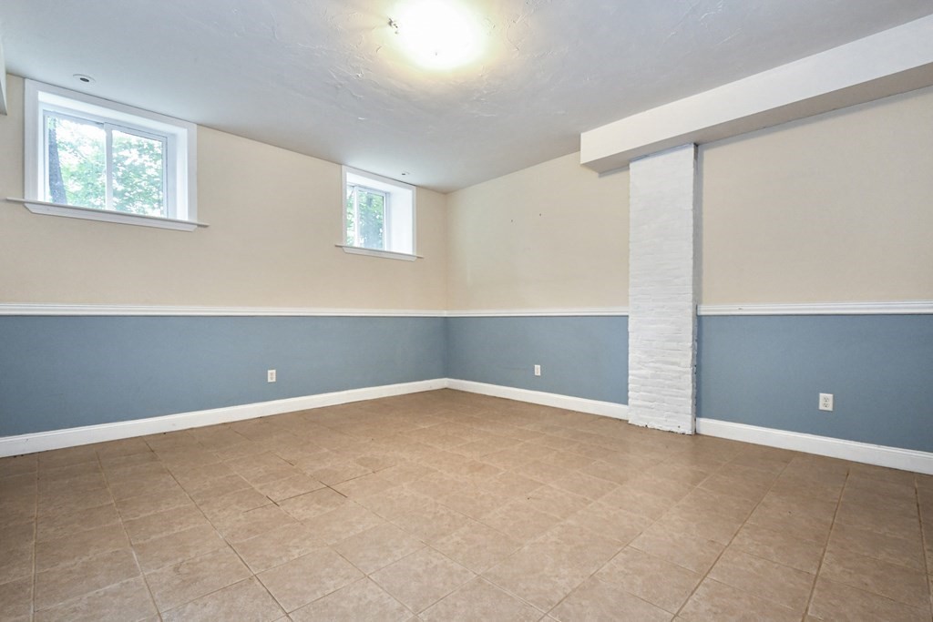 32 Providence Street, Unit 5 Worcester, MA 01604 - Photo 15 of 24 a view of an empty room with window and stairs