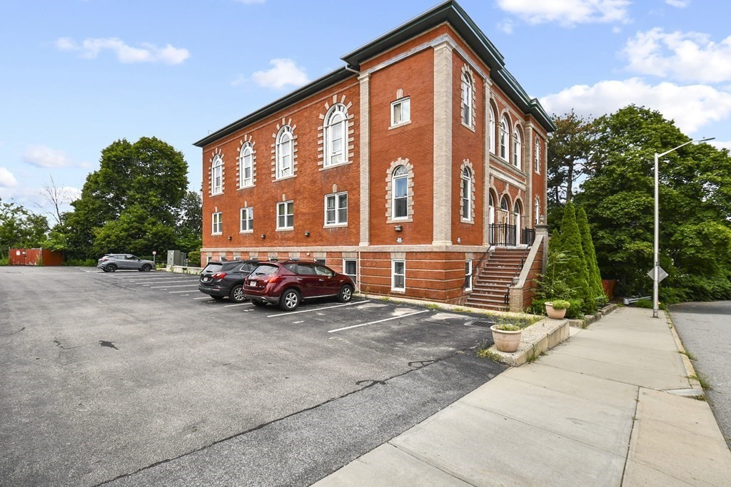 32 Providence Street, Unit 5 Worcester, MA 01604 - Photo 23 of 24 a view of a building with car parked