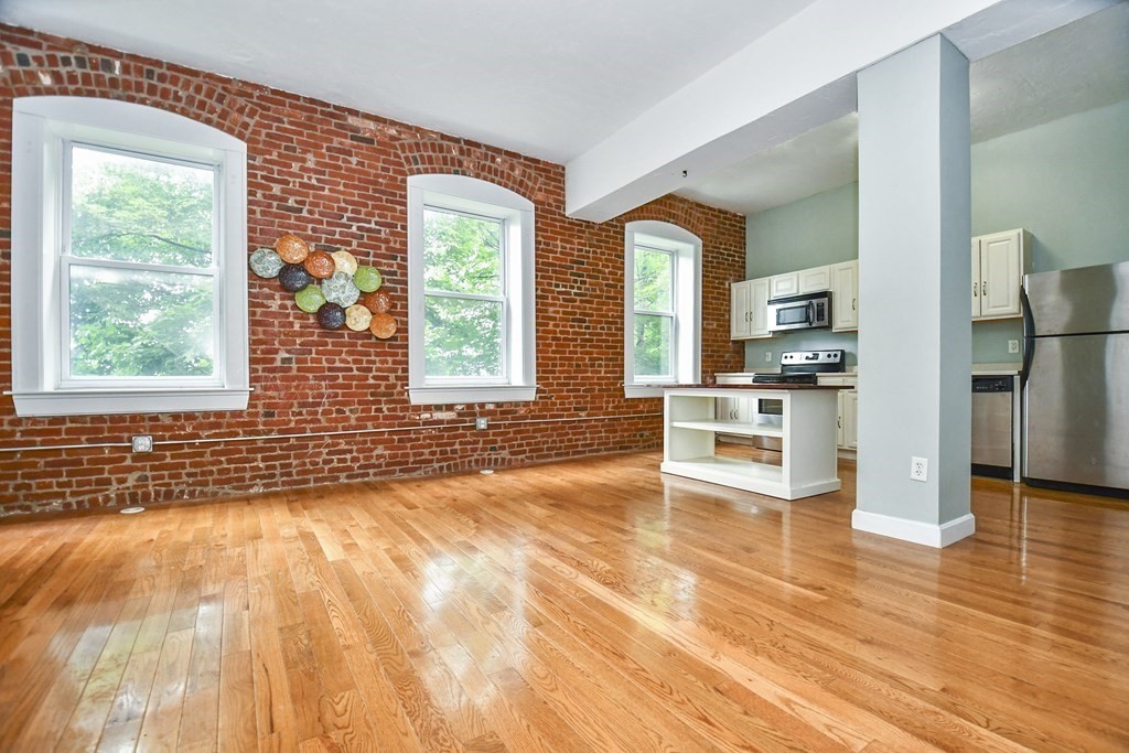 32 Providence Street, Unit 5 Worcester, MA 01604 - Photo 3 of 24 a view of a kitchen with a stove top oven
