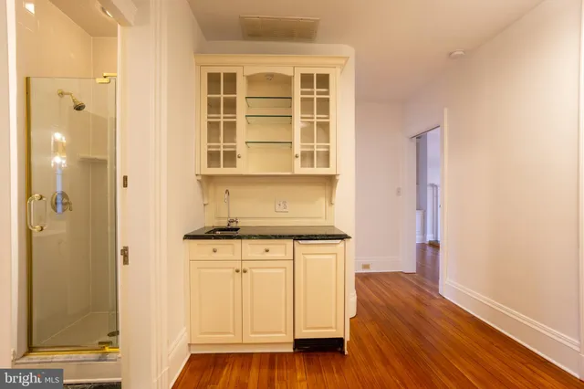 a kitchen with stainless steel appliances granite countertop a stove and a refrigerator