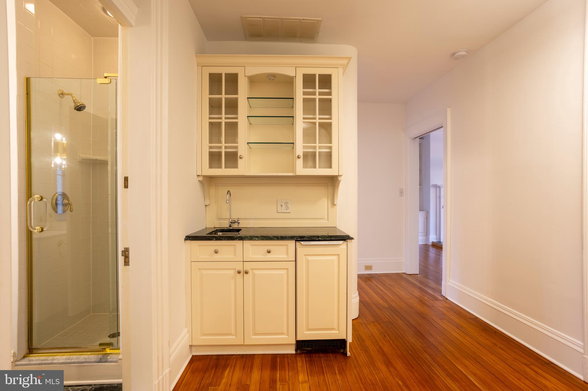 3 Devon Hill Road, Unit D4 Baltimore, MD 21210 - Photo 18 of 46 a kitchen with stainless steel appliances granite countertop a stove and a refrigerator