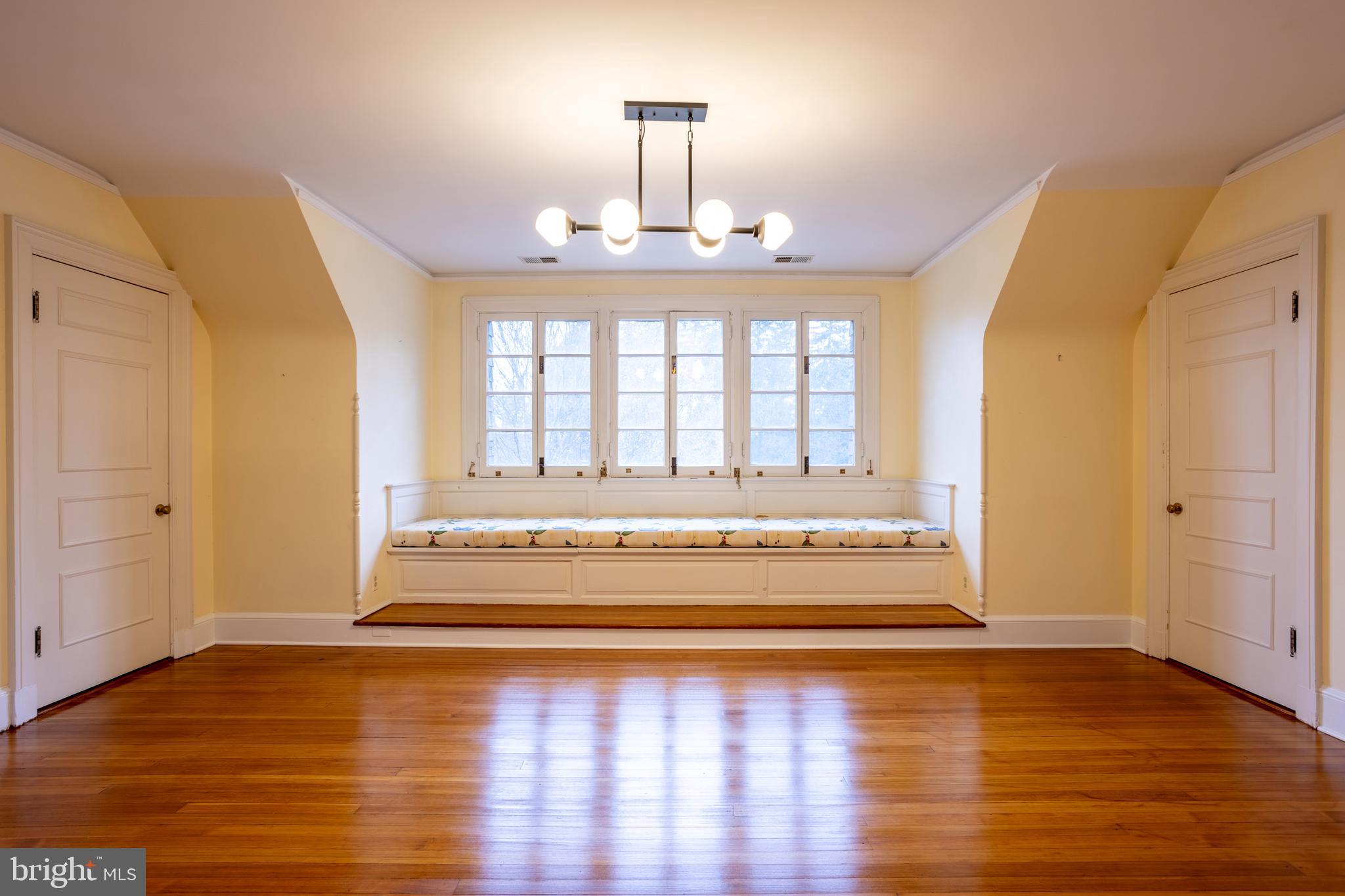 3 Devon Hill Road, Unit D4 Baltimore, MD 21210 - Photo 38 of 46 a view of an empty room with window and wooden floor
