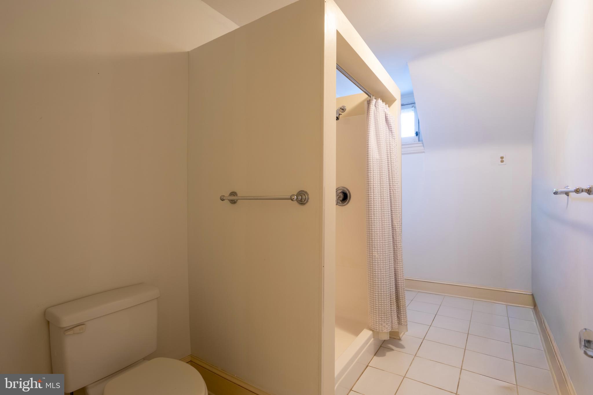 3 Devon Hill Road, Unit D4 Baltimore, MD 21210 - Photo 40 of 46 a bathroom with a granite countertop toilet and a shower