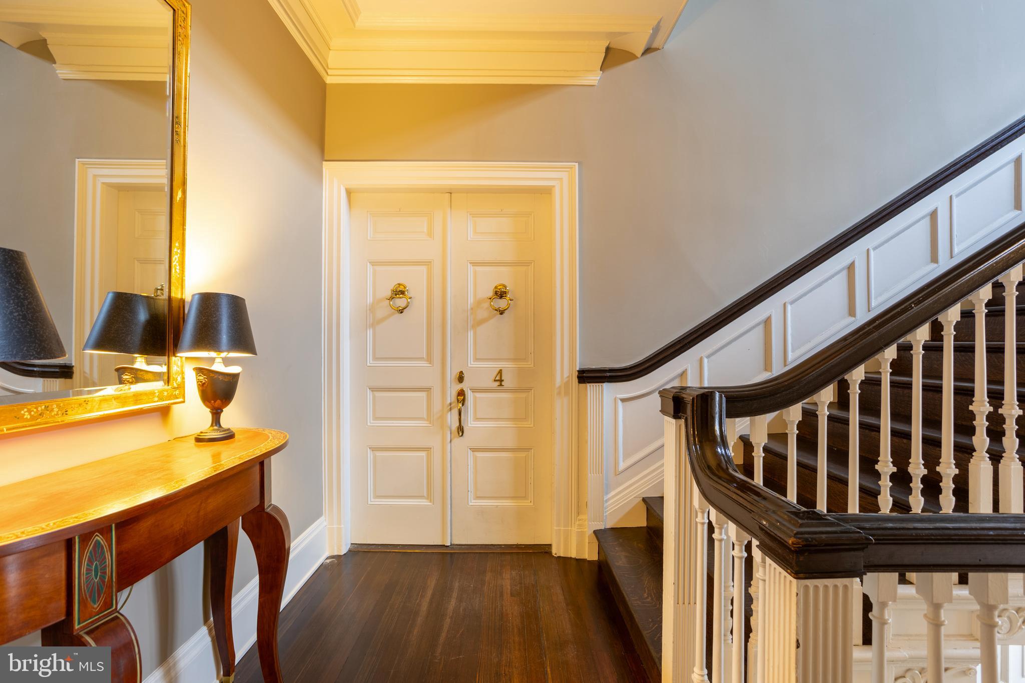 3 Devon Hill Road, Unit D4 Baltimore, MD 21210 - Photo 4 of 46 a view of a hallway with wooden floor and staircase