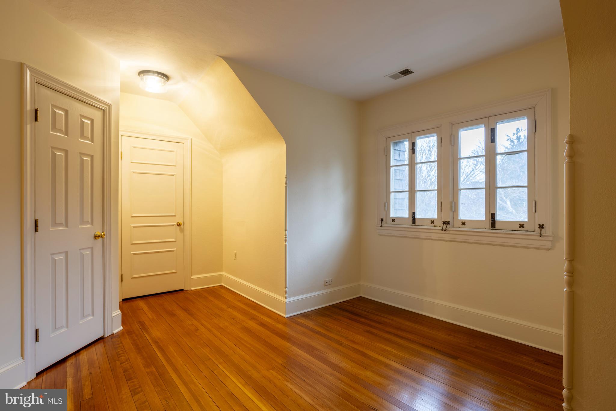 3 Devon Hill Road, Unit D4 Baltimore, MD 21210 - Photo 45 of 46 wooden floor in an empty room with a window