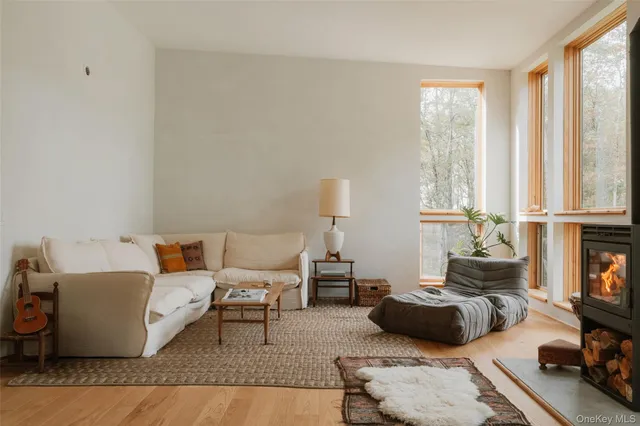 a living room with furniture and a stair