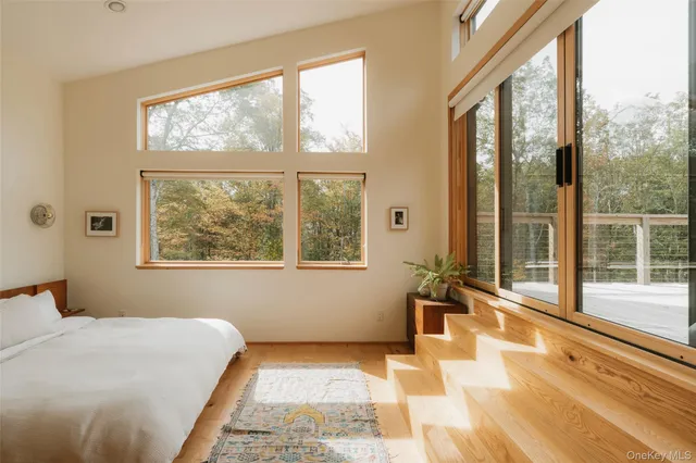 a view of a chair and table on the wooden deck