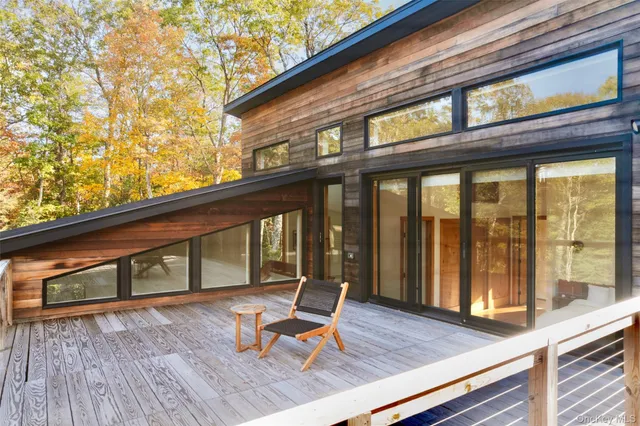 a room with furniture and a large window