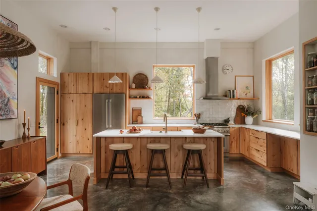 a kitchen with a sink stove and a window