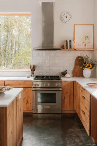 a view of a dining room with furniture and a window
