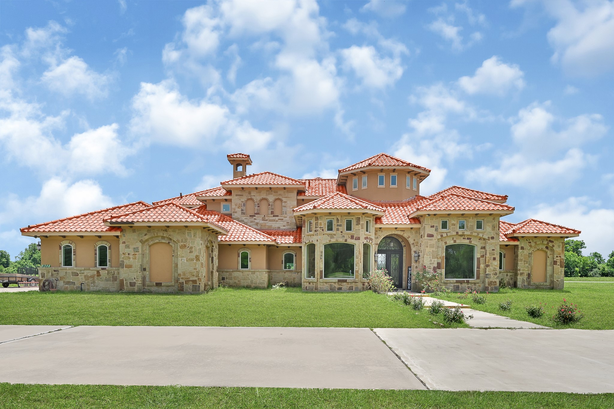 a front view of a house with a yard