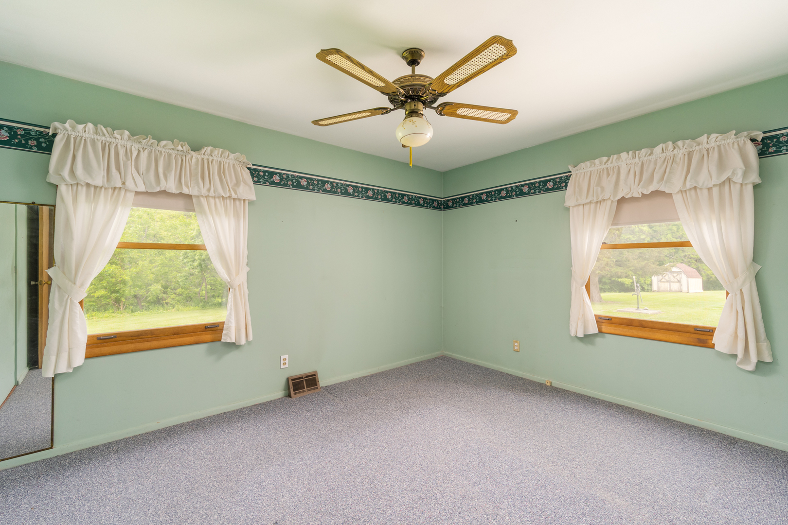 698 North 2853rd Road LaSalle, IL 61301 - Photo 15 of 39 a view of a livingroom with a ceiling fan and a window