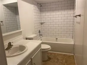 a bathroom with a sink a toilet and bathtub