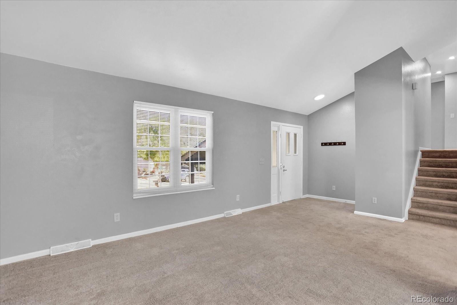 3754 South Walden Way Aurora, CO 80013 - Photo 6 of 32 a view of an empty room with a window