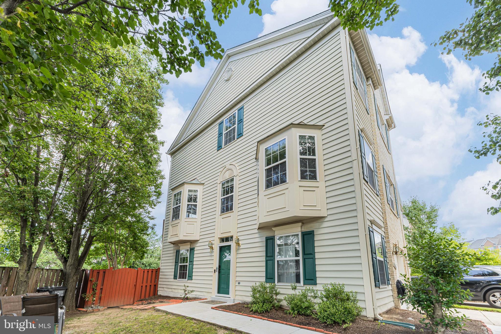 8226 Bates Road Lorton, VA 22079 - Photo 1 of 20 a view of a white house next to a yard