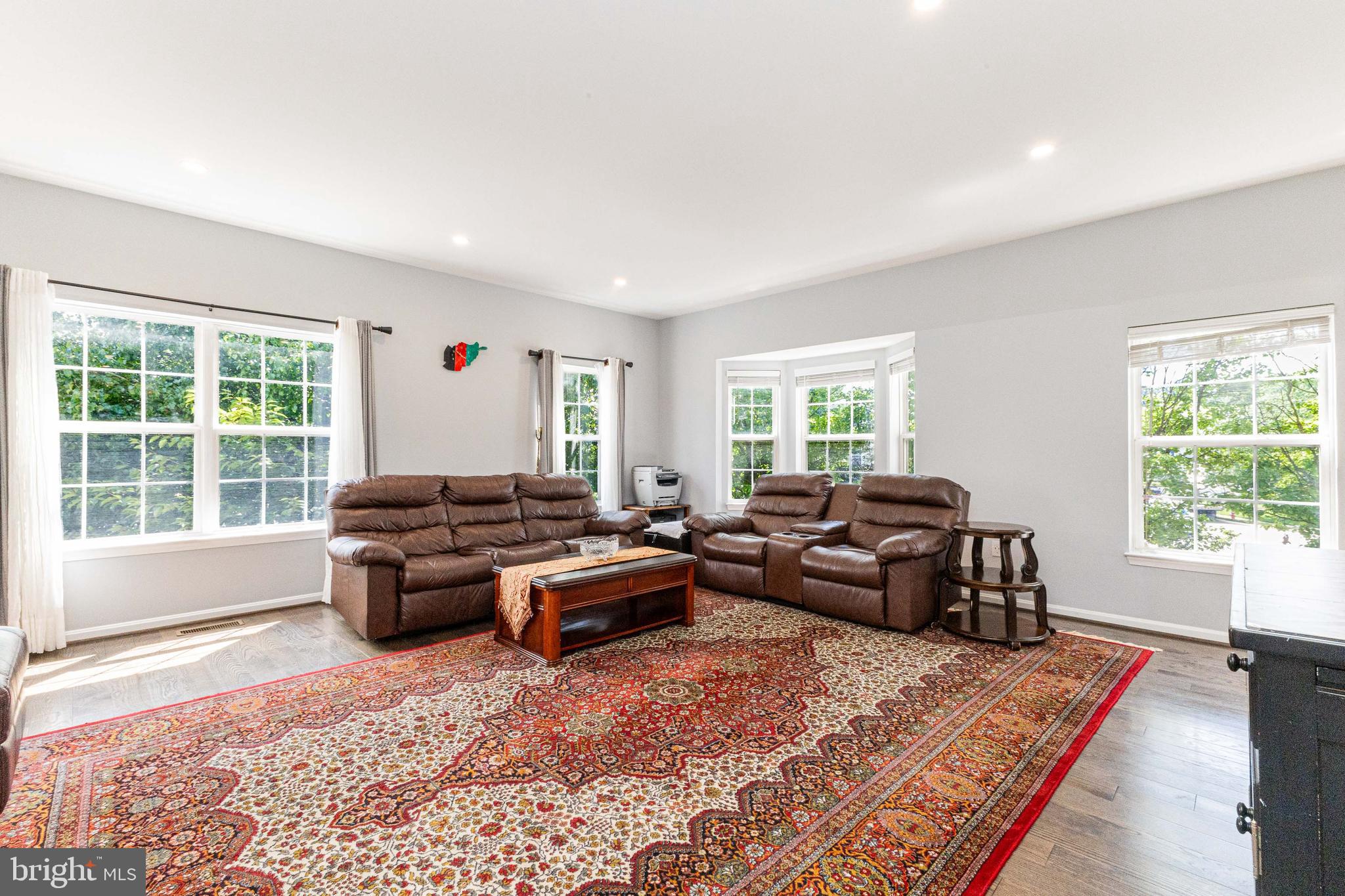 8226 Bates Road Lorton, VA 22079 - Photo 11 of 20 a living room with furniture and a rug