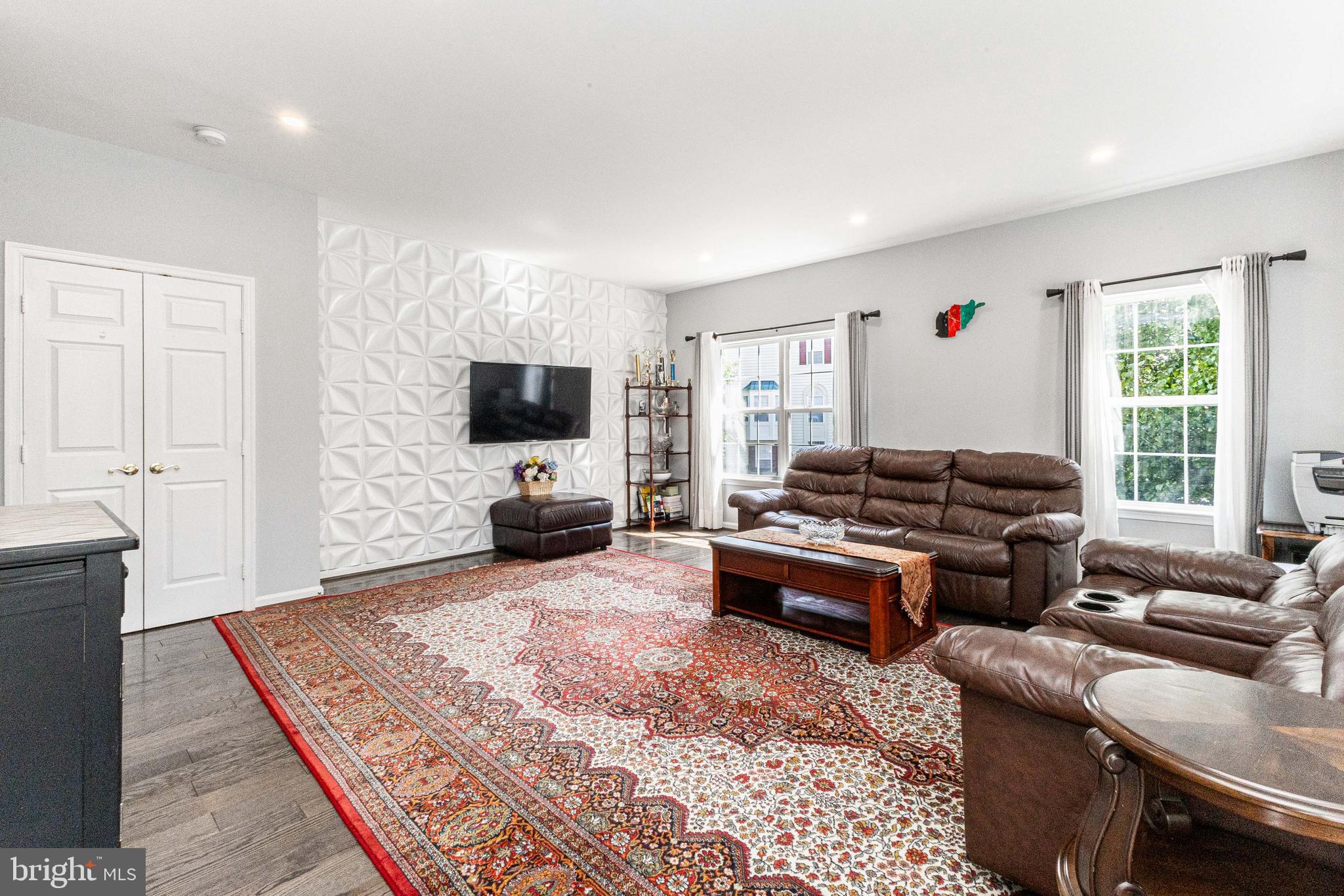 8226 Bates Road Lorton, VA 22079 - Photo 10 of 20 a living room with furniture and a flat screen tv