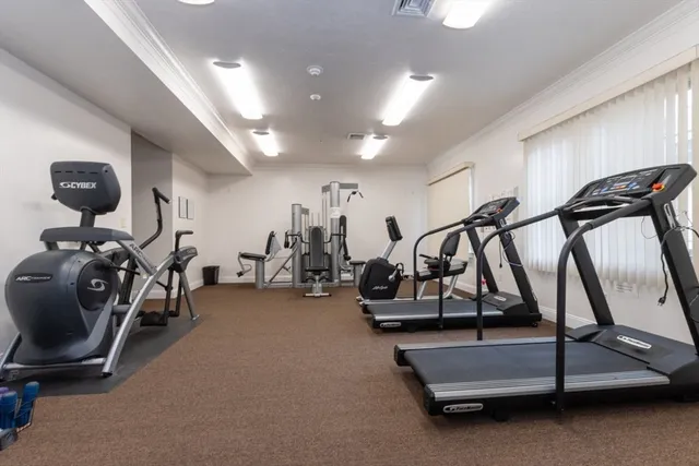 a view of a livingroom with furniture and a window